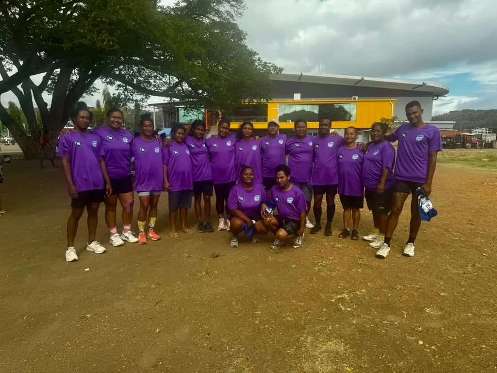 The PIN JETS Mixed Netball Team, proudly wearing their purple uniforms sponsored by Pay It Now PNG Limited.