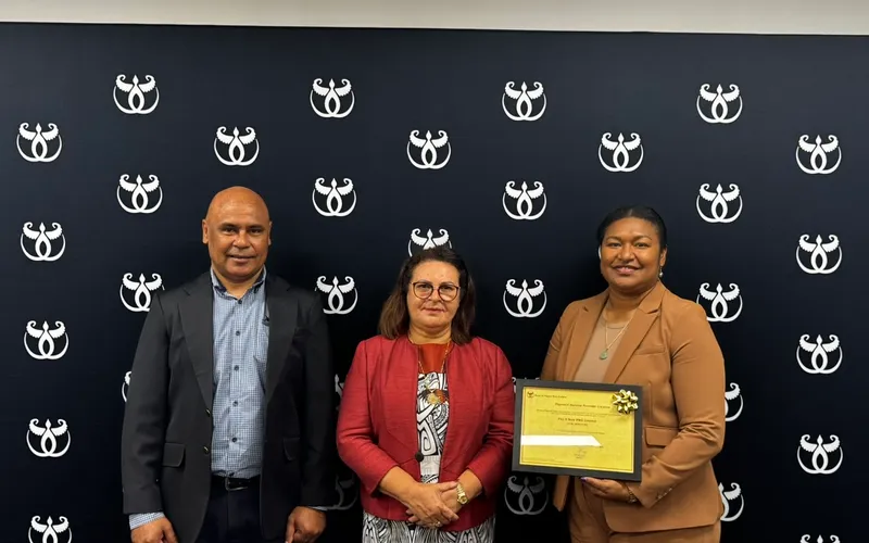 The Pay It Now PNG team with the company's Payment Service Provider licence at the BPNG office