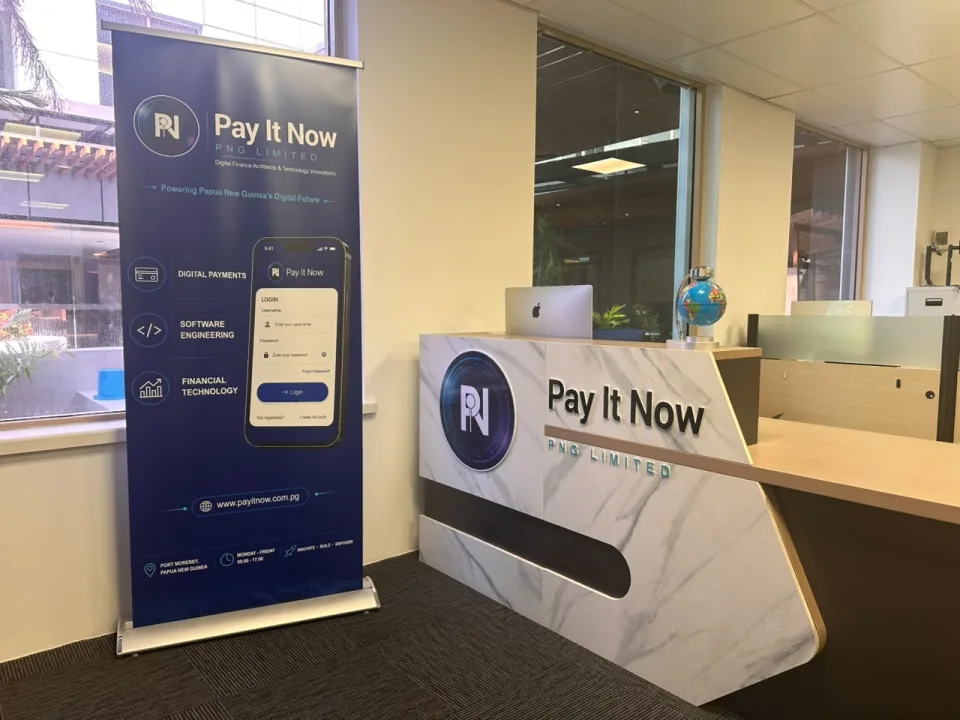 Pay It Now PNG reception with company signage