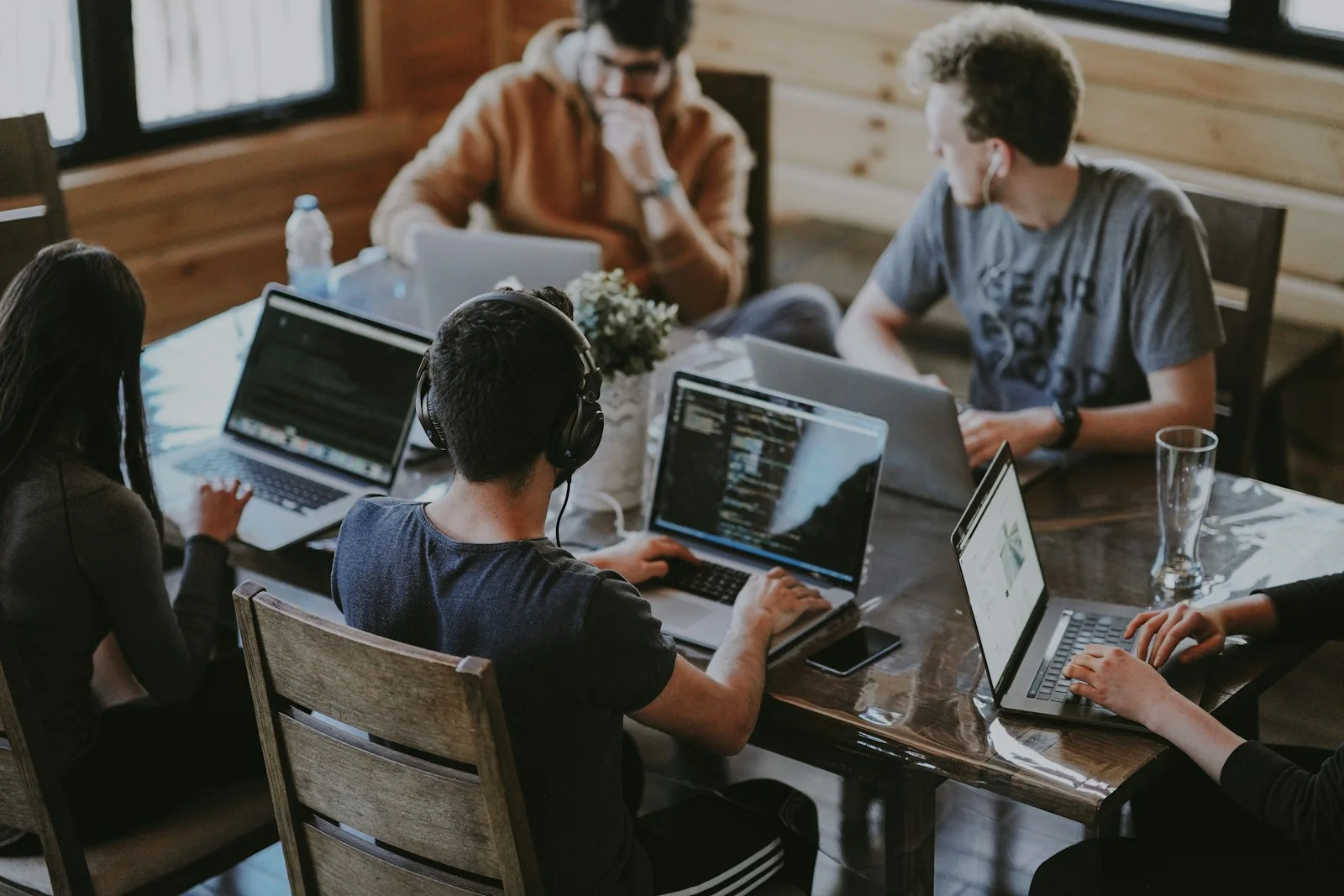 Software engineering team working together across shared development systems