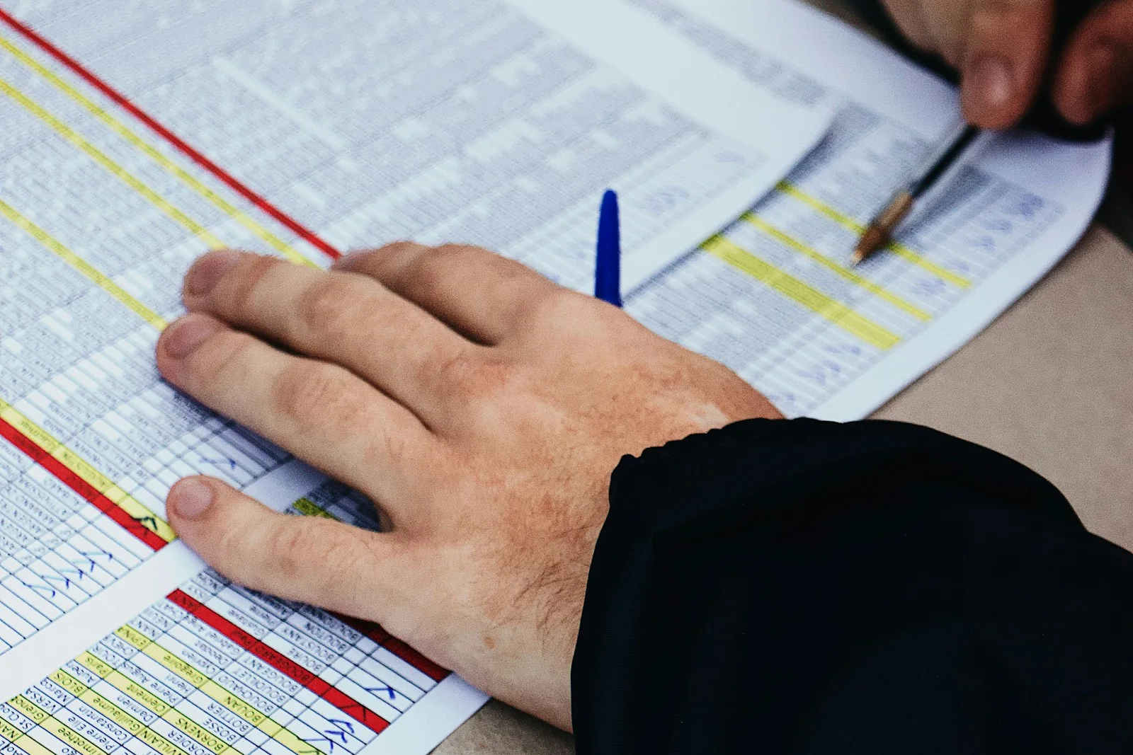 Detailed financial records being reviewed and checked for reporting